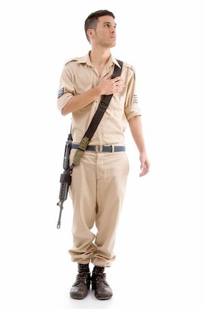 standing soldier with gun putting hand on his chest with white background Stock Photo - Budget Royalty-Free & Subscription, Code: 400-05010364