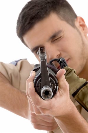 young soldier aiming on an isolated background Stock Photo - Budget Royalty-Free & Subscription, Code: 400-05010365