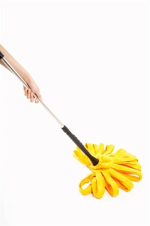 domestic floor cleaners - The image of a yellow mop in a hand, isolated Stock Photo - Budget Royalty-Free & Subscription, Code: 400-05010413