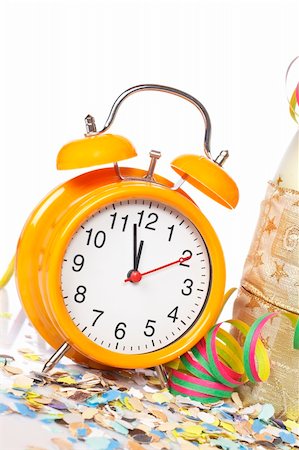 simsearch:400-05082002,k - Waiting the New Year with champagne bottle and clock. Shallow depth of field Photographie de stock - Aubaine LD & Abonnement, Code: 400-05010864