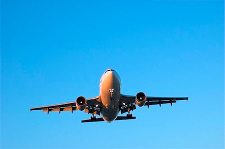 plane flying large sky blue wing - Wide body airliner approaching for landing in clear blue skies Stock Photo - Budget Royalty-Free & Subscription, Code: 400-05010931