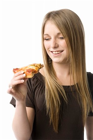 Beautiful young blond woman about to eat a slice of pizza. Foto de stock - Super Valor sin royalties y Suscripción, Código: 400-05011515