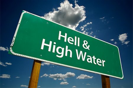 simsearch:400-04691775,k - "Hell & High Water" Road Sign with dramatic blue sky and clouds. Stockbilder - Microstock & Abonnement, Bildnummer: 400-05011737