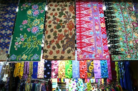 Traditional asian fabrics and clothes for sale in a shop in Malaysia Stock Photo - Budget Royalty-Free & Subscription, Code: 400-05012165