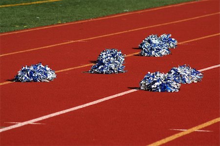 simsearch:400-04869312,k - Cheerleader pom poms near a football field Photographie de stock - Aubaine LD & Abonnement, Code: 400-05012287