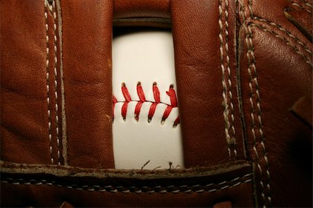 A close up of a Baseball in a glove Photographie de stock - Aubaine LD & Abonnement, Code: 400-05012309