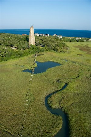 swamp aerial - Aerial view of Old Baldy lighthouse in marshy lowlands of Bald Head Island, North Carolina. Stock Photo - Budget Royalty-Free & Subscription, Code: 400-05012364