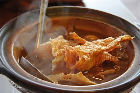 steam asian soup - Chinese traditional herbal claypot soup hot with ladel Stock Photo - Budget Royalty-Free & Subscription, Code: 400-05012439