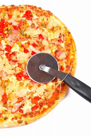 simsearch:400-04494623,k - Tasty Italian pizza and cutter, isolated on white background. Shallow DOF Foto de stock - Super Valor sin royalties y Suscripción, Código: 400-05013951