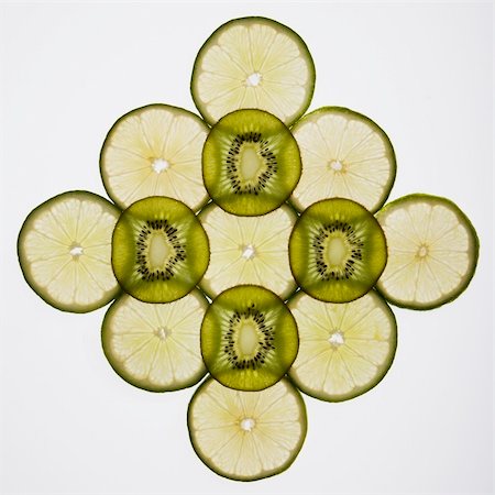 Lime and kiwi fruit slices arranged on white background. Stock Photo - Budget Royalty-Free & Subscription, Code: 400-05013986