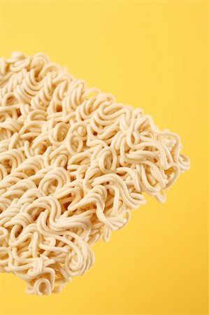 Dry ramen instant noodles with yellow background Stock Photo - Budget Royalty-Free & Subscription, Code: 400-05024600