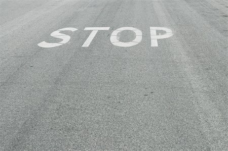 stop sign intersection - Stop painted on the road Stock Photo - Budget Royalty-Free & Subscription, Code: 400-05024726