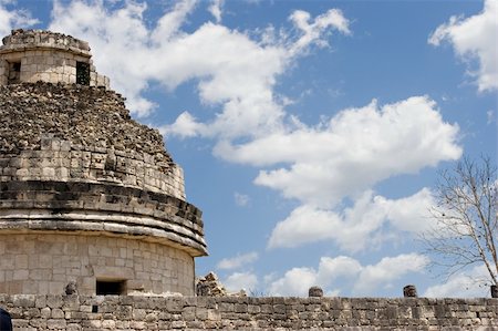 simsearch:400-05024773,k - Mayan heritage in Chichen Itza, - The Observatory El Caracol (Fragment) on the blue sky, Yucatan, Mexico Foto de stock - Royalty-Free Super Valor e Assinatura, Número: 400-05024770