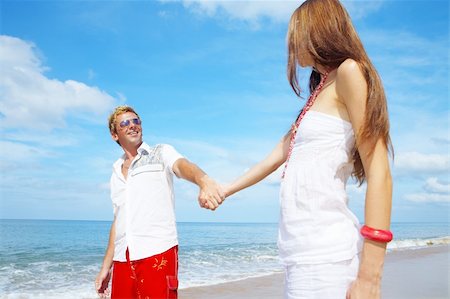 simsearch:400-05227851,k - a portrait of attractive couple having fun on the beach Fotografie stock - Microstock e Abbonamento, Codice: 400-05025152