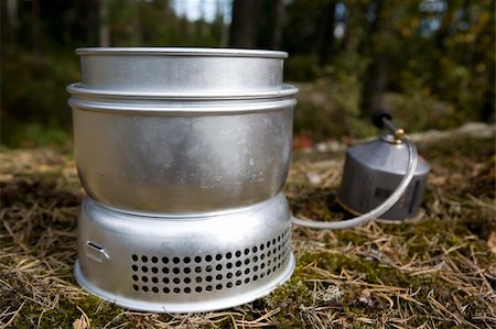 A camp stove cooking water in the forest with pressurized gas Stock Photo - Budget Royalty-Free & Subscription, Code: 400-05025740