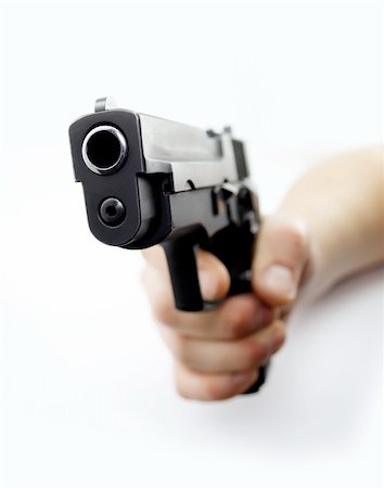 simsearch:400-05686969,k - Aim a pistol isolated on white Foto de stock - Super Valor sin royalties y Suscripción, Código: 400-05025763