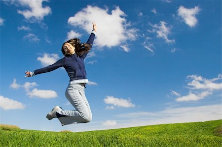 female athletic high jump - Young woman jumping in a green field Stock Photo - Budget Royalty-Free & Subscription, Code: 400-05025835