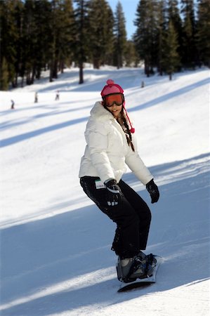 extreme cold clothes women - A snowboarding young woman having fun on a slope. Stock Photo - Budget Royalty-Free & Subscription, Code: 400-05025870