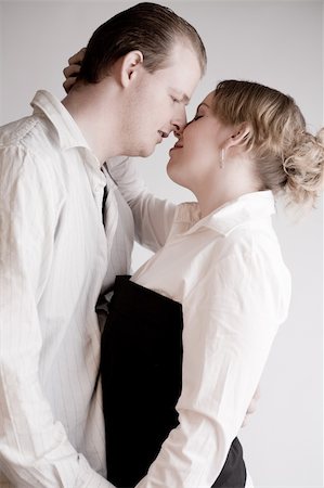 simsearch:400-04482792,k - Studio portrait of a young amorous couple Stock Photo - Budget Royalty-Free & Subscription, Code: 400-05026104