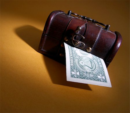 simsearch:614-05955597,k - Wood cashbox isolated on brown Stock Photo - Budget Royalty-Free & Subscription, Code: 400-05026170