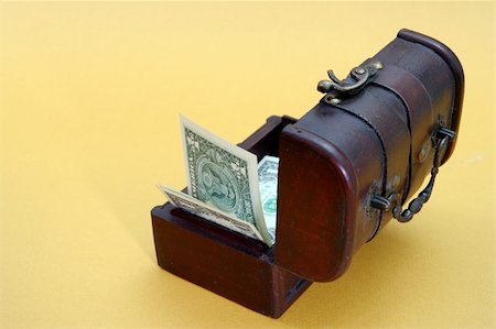 simsearch:614-05955597,k - Wood cashbox isolated on yellow Stock Photo - Budget Royalty-Free & Subscription, Code: 400-05026171