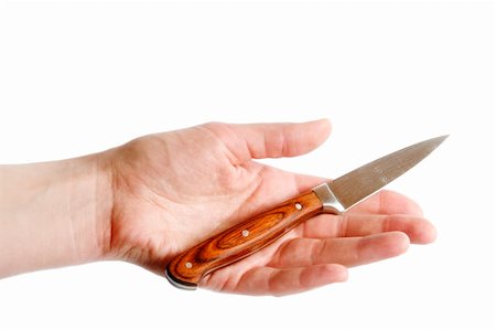 A small pearing knife in the open hand of a woman, isolated on white with clipping mask. Stock Photo - Budget Royalty-Free & Subscription, Code: 400-05026755