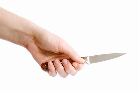 A small pearing knife in a female hand, ready to cut something.  Isolated on white with clipping path. Stock Photo - Budget Royalty-Free & Subscription, Code: 400-05026756