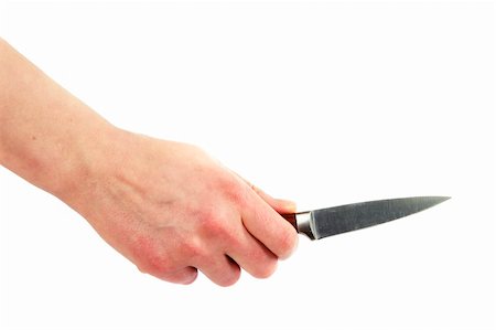 A small pearing knife in a female hand, ready to cut something.  Isolated on white with clipping path. Stock Photo - Budget Royalty-Free & Subscription, Code: 400-05026757