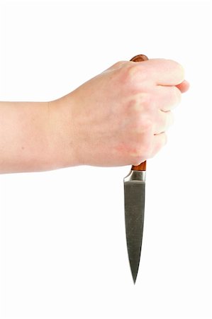 A small pearing knife in the hand of a woman.  The knife is held in a dagger grip. Isolated on white with clipping path. Stock Photo - Budget Royalty-Free & Subscription, Code: 400-05026760
