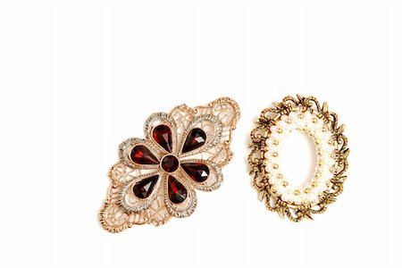 Two brooch on white background with pearls and gems in gold. Stock Photo - Budget Royalty-Free & Subscription, Code: 400-05027080