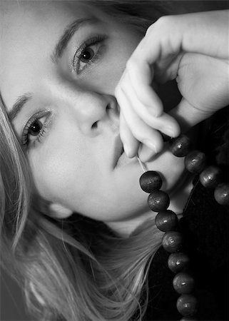 simsearch:400-08831347,k - Young beautiful woman holds beads. Black and white photo Stock Photo - Budget Royalty-Free & Subscription, Code: 400-05027207