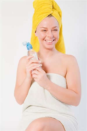 funny wellness healthcare - Studio portrait of a spa girl smiling with a bottle Stock Photo - Budget Royalty-Free & Subscription, Code: 400-05027890