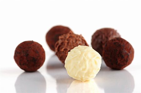 Several assorted chocolate truffles isolated on white background Stock Photo - Budget Royalty-Free & Subscription, Code: 400-05028051