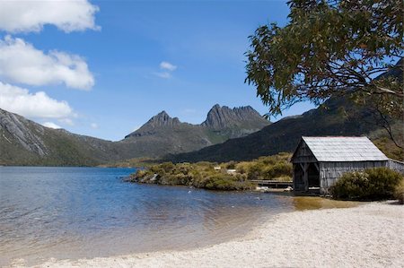 simsearch:400-04493526,k - An old boathouse rests by the calm lakeside at Cradle Mountain in Australia's wild state of Tasmania. Stock Photo - Budget Royalty-Free & Subscription, Code: 400-05028164