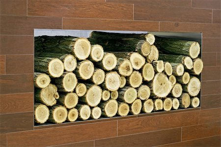 Big log of fire wood in the wall Stock Photo - Budget Royalty-Free & Subscription, Code: 400-05028564