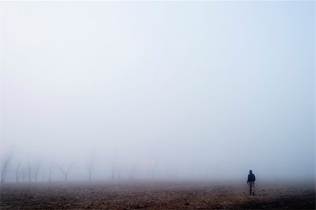 rainy season man walking - Walking in the fog Stock Photo - Budget Royalty-Free & Subscription, Code: 400-05028589