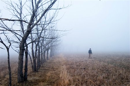 rainy season man walking - Walking in the fog Stock Photo - Budget Royalty-Free & Subscription, Code: 400-05028591