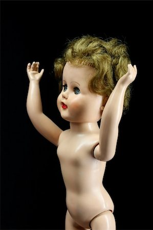 simsearch:400-03945849,k - An old worn doll with arms reaching up Foto de stock - Royalty-Free Super Valor e Assinatura, Número: 400-05028730
