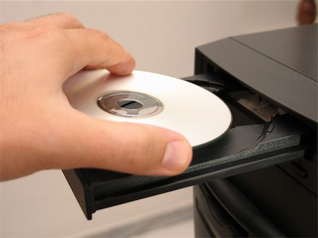 royal ontario museum - Inserting the CD in a CD-ROM drive Stock Photo - Budget Royalty-Free & Subscription, Code: 400-05028973