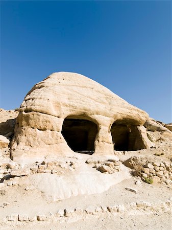 simsearch:400-05033205,k - Tombs in Petra - Nabataeans capital city (Al Khazneh) , Jordan. Made by digging a holes in the rocks. Roman Empire period. Photographie de stock - Aubaine LD & Abonnement, Code: 400-05029156