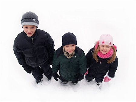 sparkia (artist) - three children in winter clothes standing in the snow Stockbilder - Microstock & Abonnement, Bildnummer: 400-05029158