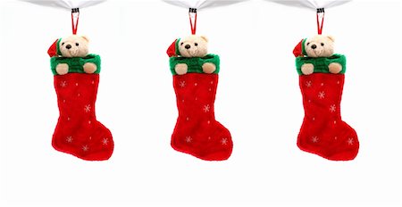 socks group - three christmas boots filled with gifts Stock Photo - Budget Royalty-Free & Subscription, Code: 400-05029248