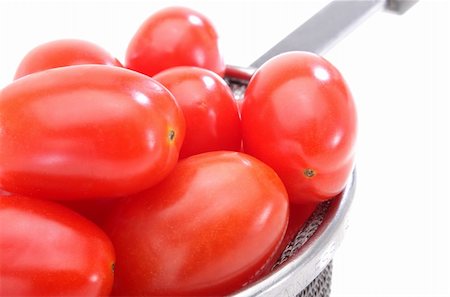Close up of a group organic grape tomatoes in a strainer. Stock Photo - Budget Royalty-Free & Subscription, Code: 400-05029995