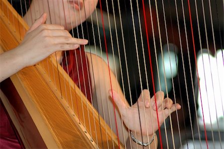 Female musician playing the harp Photographie de stock - Aubaine LD & Abonnement, Code: 400-05020049