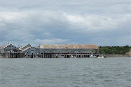 echoforsberg (artist) - These are old buildings that were once used as canneries and similar fishing industry type businesses. Taken on the Naknek River in Bristol Bay, Alaska. Fotografie stock - Microstock e Abbonamento, Codice: 400-05020084