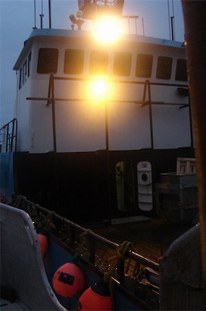 At the end of the opening, boats deliver their loads of red salmon to the tenders to be weighed and stored for delivery to the canneries. Stock Photo - Budget Royalty-Free & Subscription, Code: 400-05020088