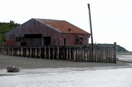 simsearch:400-05020089,k - These are old buildings that were once used as canneries and similar fishing industry type businesses. Taken on the Naknek River in Bristol Bay, Alaska. Photographie de stock - Aubaine LD & Abonnement, Code: 400-05020097
