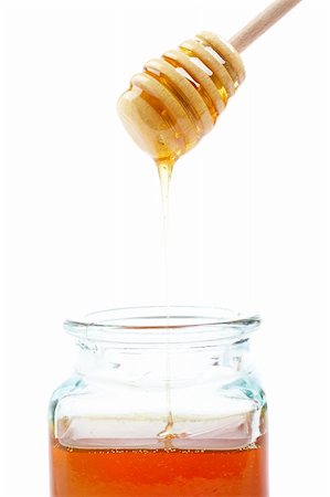 simsearch:400-06387884,k - Pouring honey on glass jar, on white background Stock Photo - Budget Royalty-Free & Subscription, Code: 400-05020259