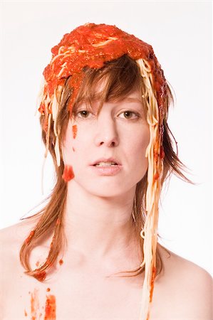 Red haired girl with a meal of spaghetti on her head Stock Photo - Budget Royalty-Free & Subscription, Code: 400-05020262