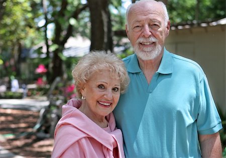 simsearch:400-03969319,k - An active senior couple walking through their garden.  Horizontal with room for text. Stock Photo - Budget Royalty-Free & Subscription, Code: 400-05020347